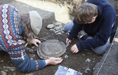 Photo of pewter plates being excavated at Fleet Marston Roman town